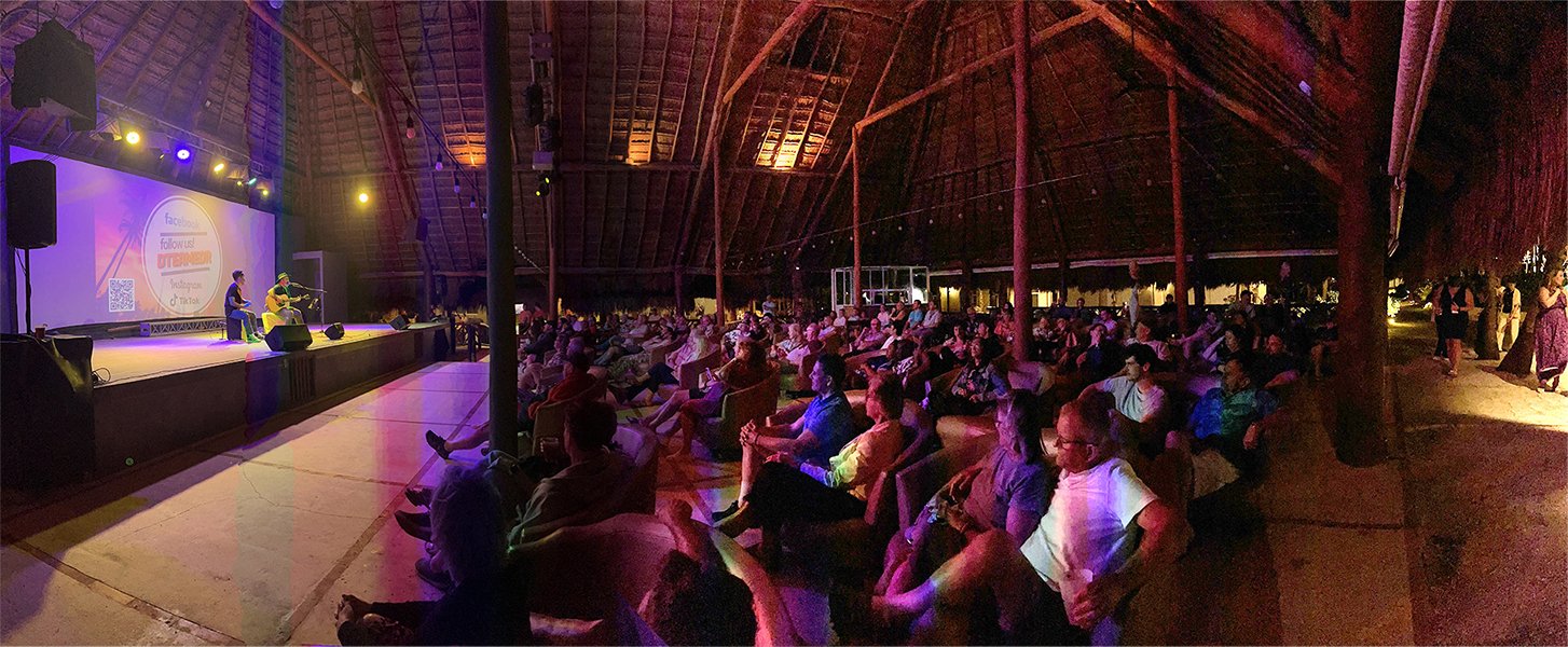 Live acoustic duo performing at Dorado Royale hotel show with full audience in Riviera Maya