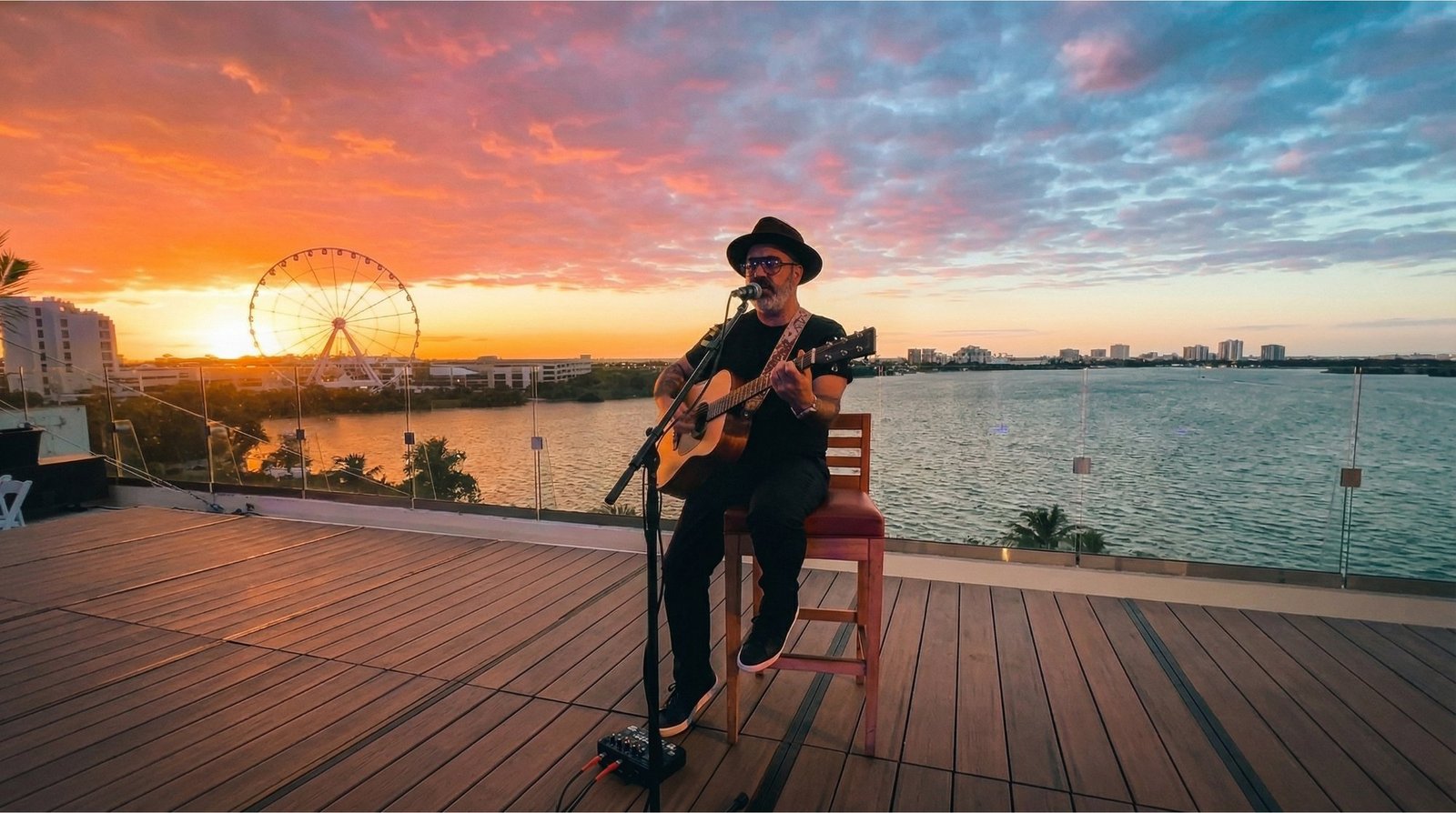 Rodo Acústico performing live at Beach Palace rooftop at sunset over Laguna Nichupté, Cancún